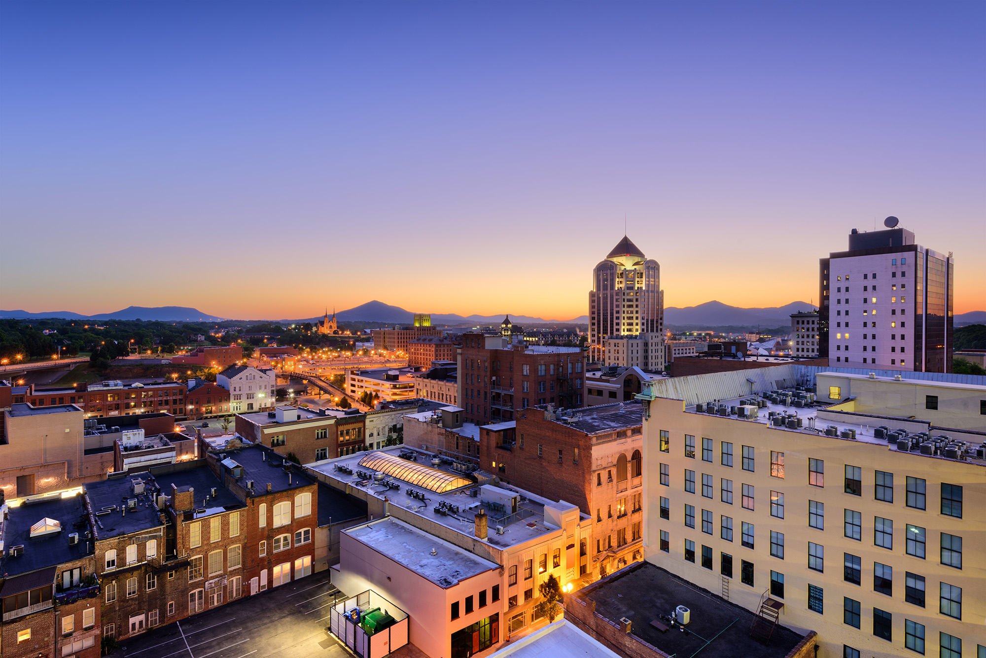 Roanoke Virginia skyline at dusk with Blue Ridge Mountains